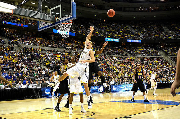 Mitch McGary (4), Glenn Robinson III (1), Trey Burke (3), and Tim Hardaway Jr. (10)