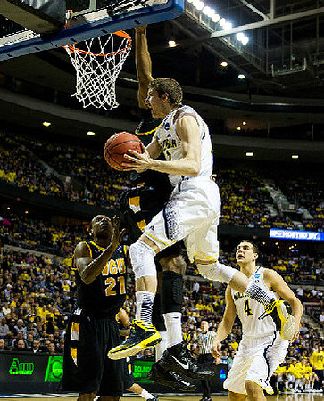 Spike Albrecht (2) and Nik Stauskas (11)