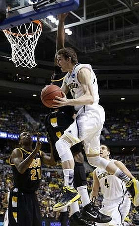 Nik Stauskas (11) and Mitch McGary (4)