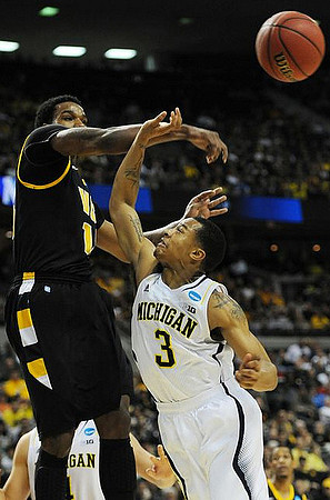 Trey Burke (3) and Mitch McGary (4)