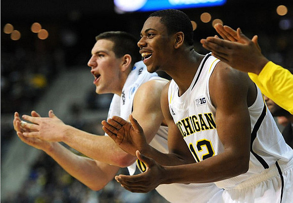 Mitch McGary (4) and Glenn Robinson III (12)