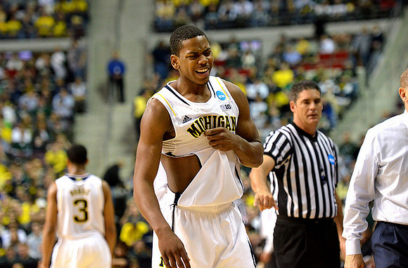Trey Burke (3) and Glenn Robinson III (1)