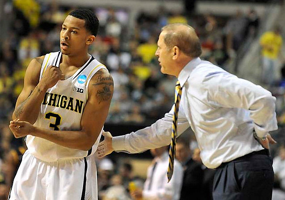 Trey Burke (3) and John Beilein