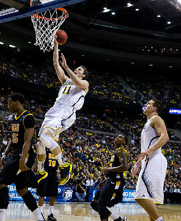 Nik Stauskas (11) and Mitch McGary (4)