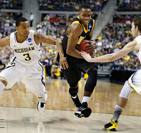 Trey Burke (3) and Nik Stauskas (11)