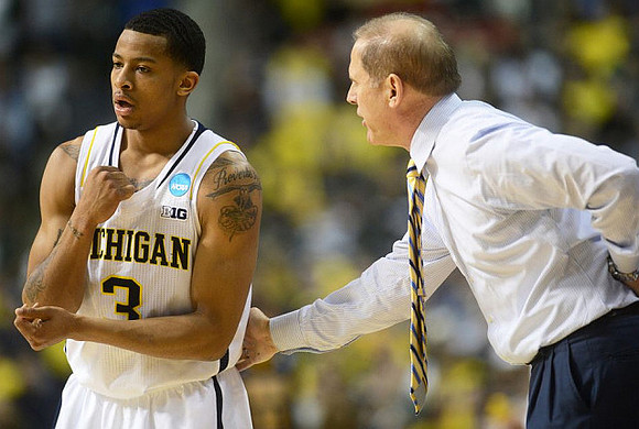 Trey Burke (3) and John Beilein