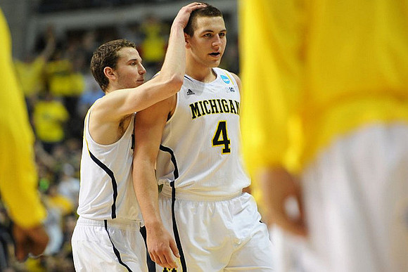Nik Stauskas (11) and Mitch McGary (4)