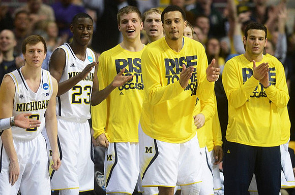 Spike Albrecht (2), Caris LeVert (23), Max Bielfeldt (44), Blake McLimans (22), Jordan Morgan (52), and Josh Bartelstein (20)