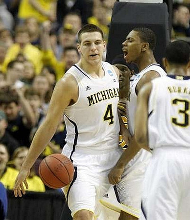 Mitch McGary (4), Glenn Robinson III (1), and Trey Burke (3)