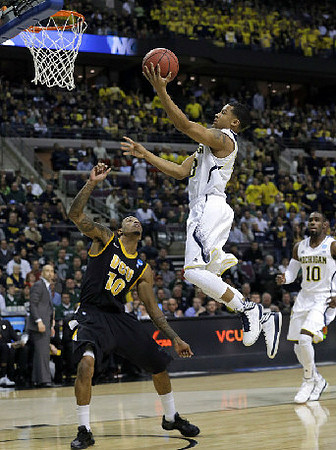 Trey Burke (3) and Tim Hardaway Jr. (10)
