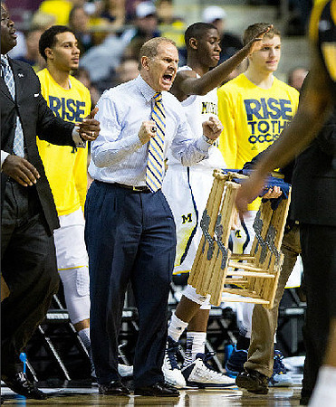 Bacari Alexander, Jordan Morgan (52), John Beilein, Caris LeVert (23), and Max Bielfeldt (44)