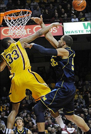 Jordan Morgan (52) and Zack Novak (0)