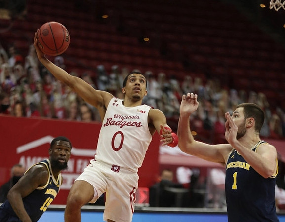 Chaundee Brown Jr. (15) and Hunter Dickinson (1)