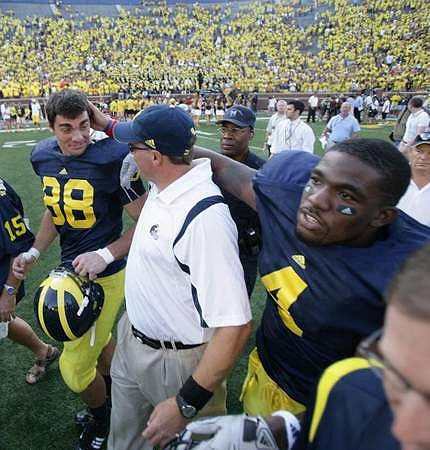 Craig Roh (88), Rich Rodriguez, and Brandon Minor (4)