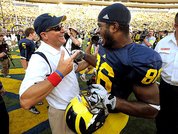 Rich Rodriguez and Kevin Koger (86)