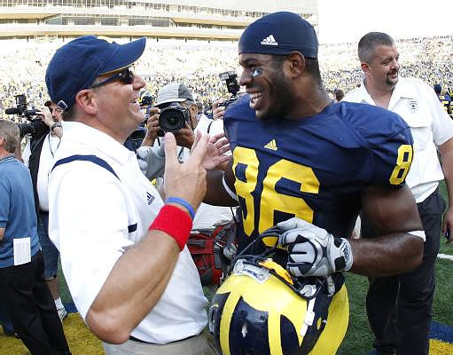 Rich Rodriguez and Kevin Koger (86)