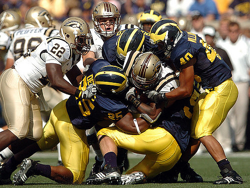 Kenny Demens (25) and Michael Williams (40)