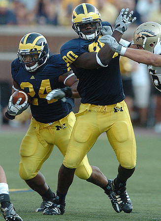 Kevin Grady (24) and Martell Webb (80)