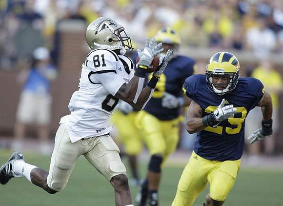 Troy Woolfolk (29) and Jonas Mouton (8)