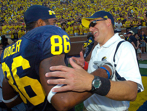 Kevin Koger (86) and Rich Rodriguez