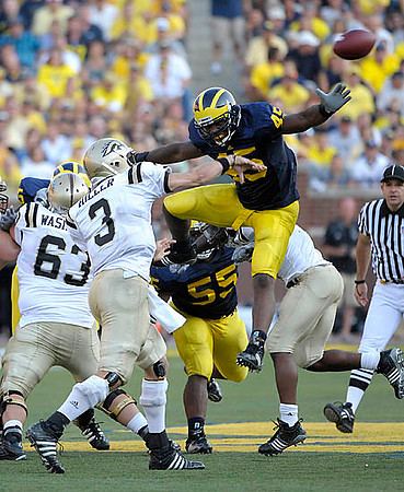 Obi Ezeh (45) and Brandon Graham (55)