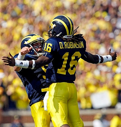 Tate Forcier (5) and Denard Robinson (16)