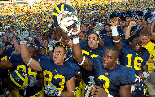 Jon Conover (83), Stevie Brown (3), Ryan Van Bergen (53), and Denard Robinson (16)