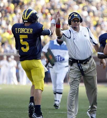 Tate Forcier (5) and Rich Rodriguez