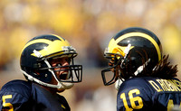 Tate Forcier (5) and Denard Robinson (16)