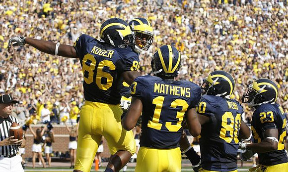 Kevin Koger (86), Greg Mathews (13), Martell Webb (80), and Carlos Brown (23)
