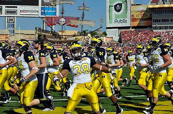 Al Backey (38) and Michigan Team