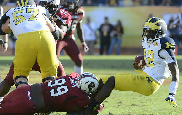 Devin Gardner (12) and Elliott Mealer (57)