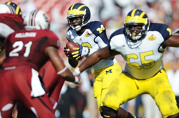 Devin Gardner (12) and Patrick Omameh (65)