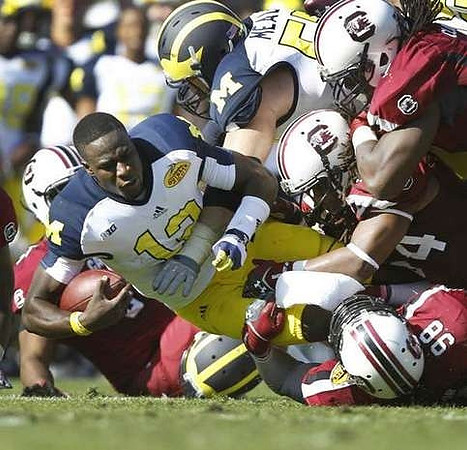 Devin Gardner (12) and Elliott Mealer (57)