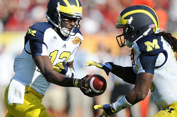 Devin Gardner (12) and Denard Robinson (16)