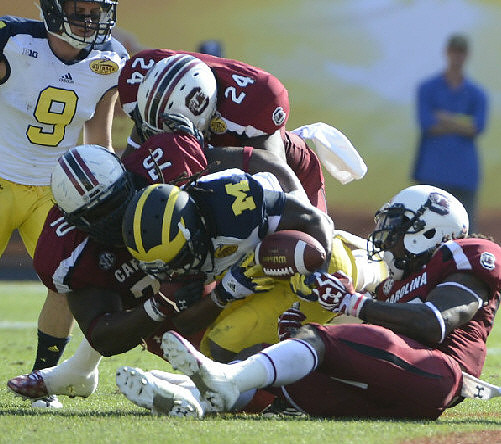 Denard Robinson (16) and Drew Dileo (9)