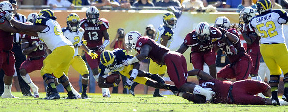 Patrick Omameh (65), Vincent Smith (2), Denard Robinson (16), and Ricky Barnum (52)