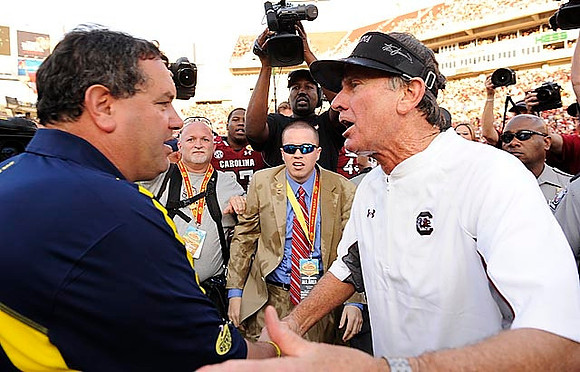 Brady Hoke and South Carolina Head Coach Steve Spurrier