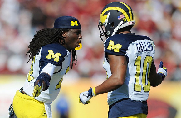 Denard Robinson (16) and Jeremy Gallon (10)