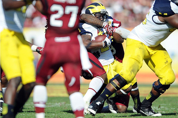 Devin Gardner (12) and Patrick Omameh (65)