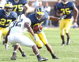 Braylon Edwards (80), Calvin Bell (27), David Baas (75), and B.J. Askew (35)