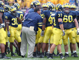 Brady Hoke, Gabe Watson (78), Markus Curry (30), Carl Diggs (43), Zach Kaufman (37), and Grant Bowman (60)
