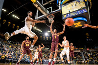 Derrick Walton Jr. (10), D.J. Wilson (5), and Moritz Wagner (13)