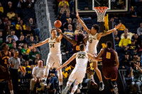 Mark Donnal (34), Duncan Robinson (22), and D.J. Wilson (5)