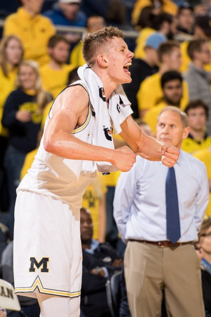 Moritz Wagner (13) and John Beilein