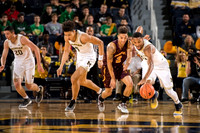 Sean Lonergan (20), D.J. Wilson (5), and Zak Irvin (21)