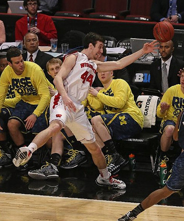Josh Bartelstein (20), Blake McLimans (22), Matt Vogrich (13), Spike Albrecht (2), and C.J. Lee