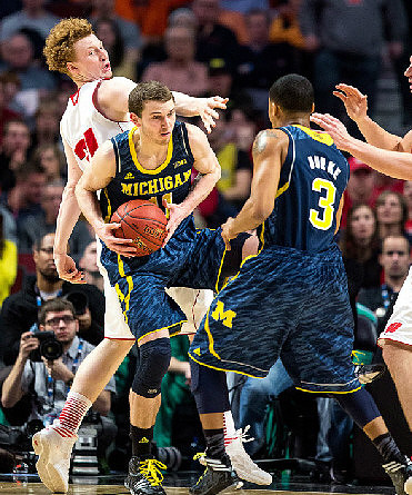Nik Stauskas (11) and Trey Burke (3)