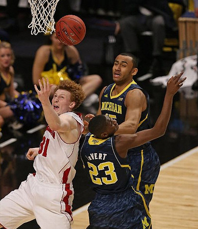 Caris LeVert (23) and Trey Burke (3)