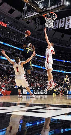Glenn Robinson III (1) and Nik Stauskas (11)